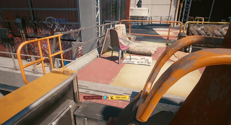 A screenshot of the player sitting in the rollercoaster in Cyberpunk 2077