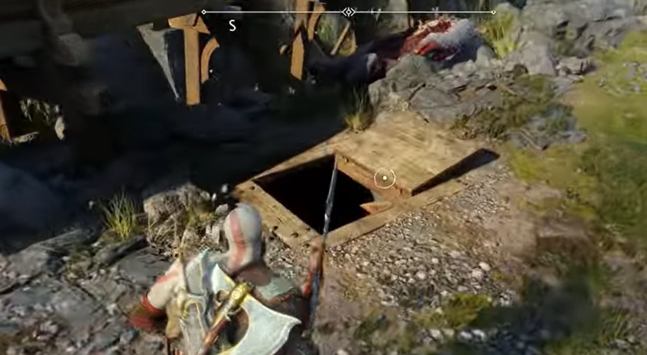 A screenshot of Kratos approaching a trapdoor in God of War: Ragnarok