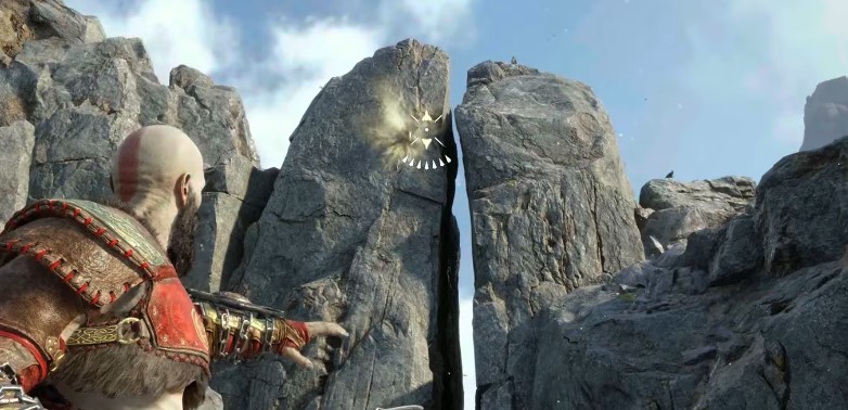 A screenshot showing a section of rocks where Kratos can see an embedded point in God of War: Ragnarok