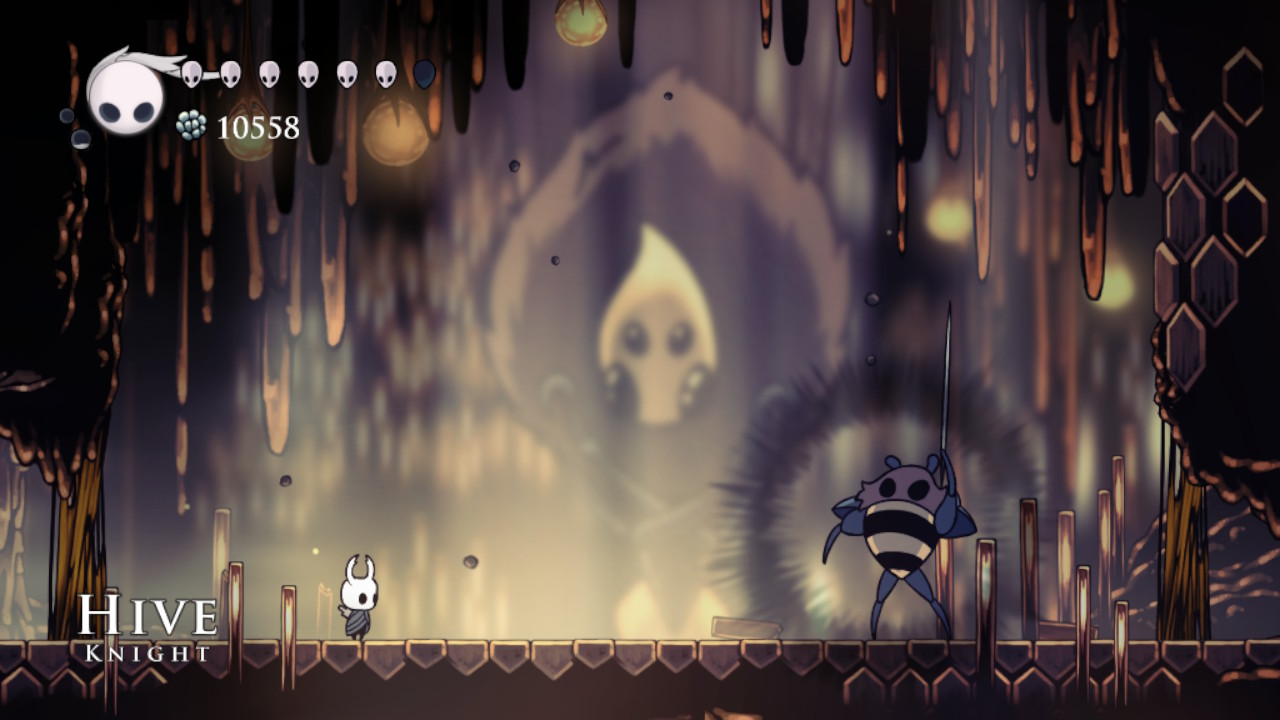 A screenshot of the Hive Knight in Hollow Knight