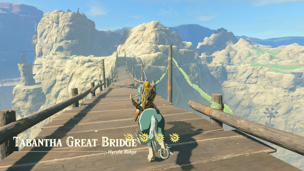 A screenshot showing Link riding his horse across the Tabantha Great Bridge