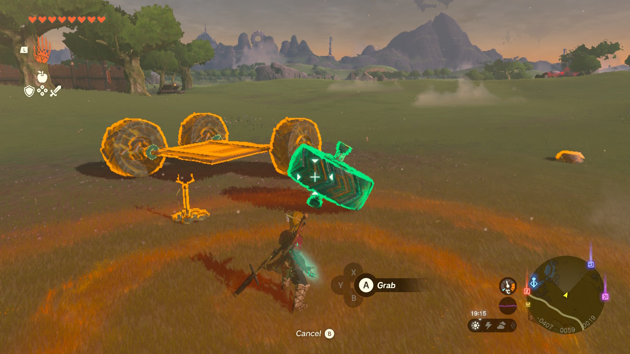 A screenshot showing Link building a car in Tears of the Kingdom