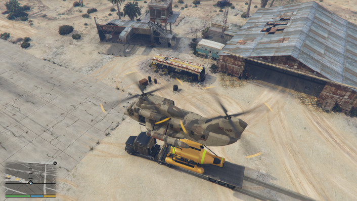 A screenshot showing the Cargobob picking up a vehicle in GTA 5