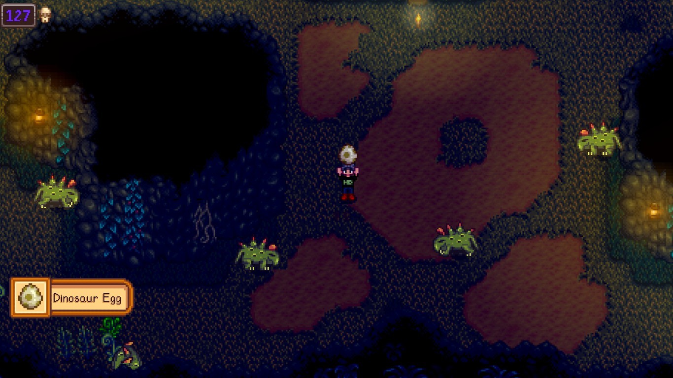 An image of the player holding up a dinosaur egg in Skull Caverns.
