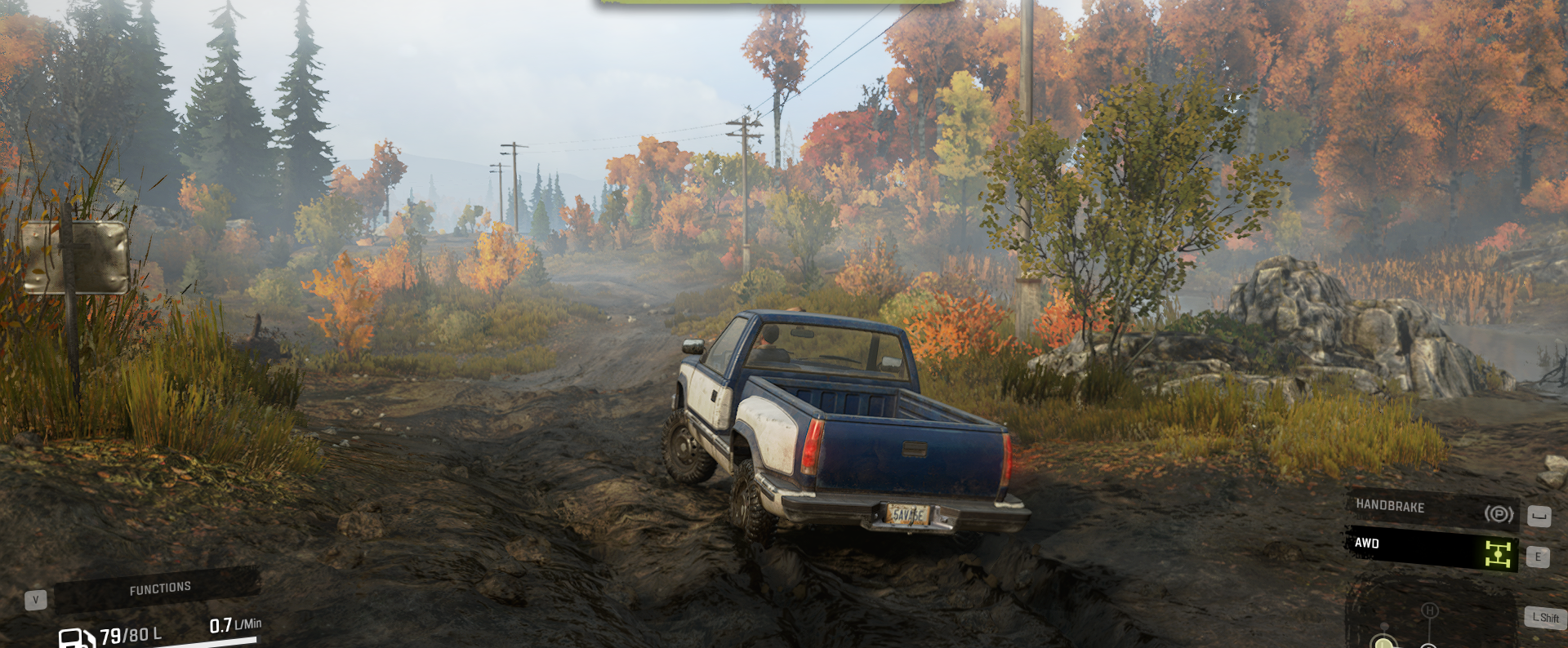 A screenshot of a truck in Snowrunner wading through a muddy trail.