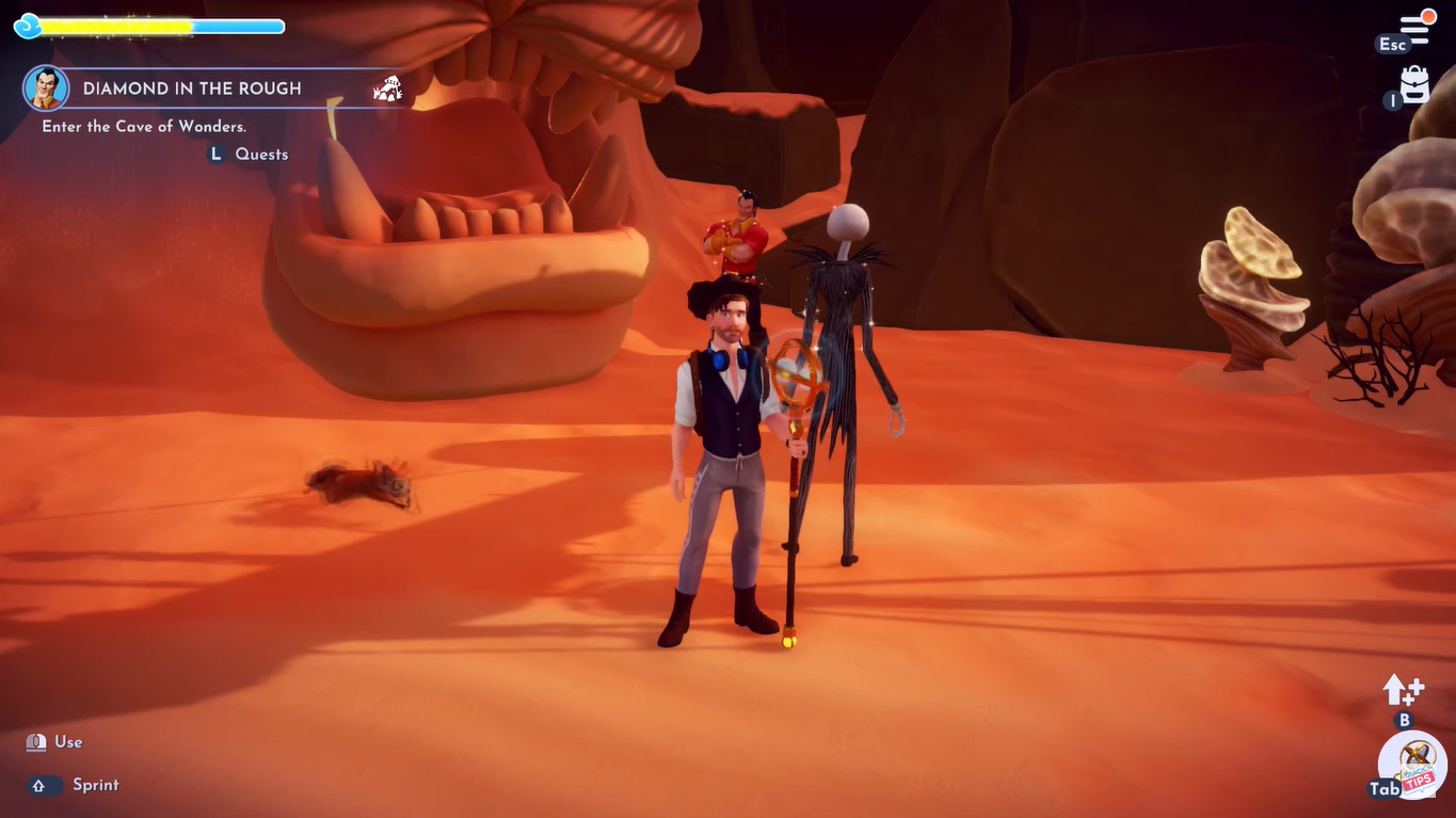 A screenshot of the player, Gaston, and Jack Skellington standing outside the Cave of Wonders.